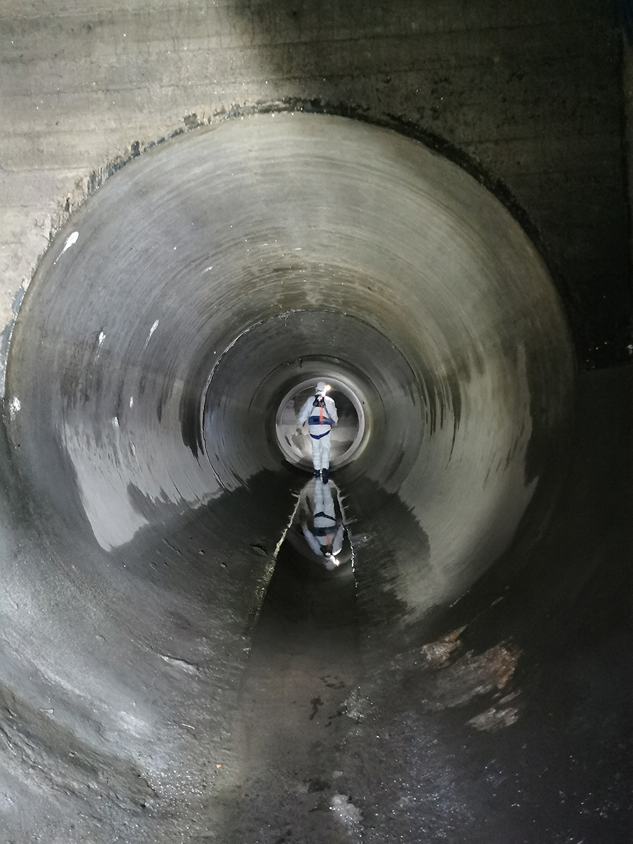Scientist walking in the storm sewer